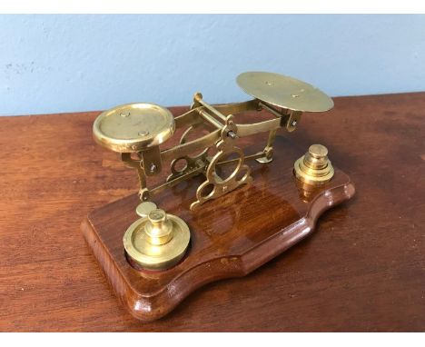 A Set of old postal scales with weights. 