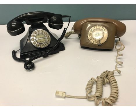 Vintage light brown telephone together with a modern black vintage style phone. 