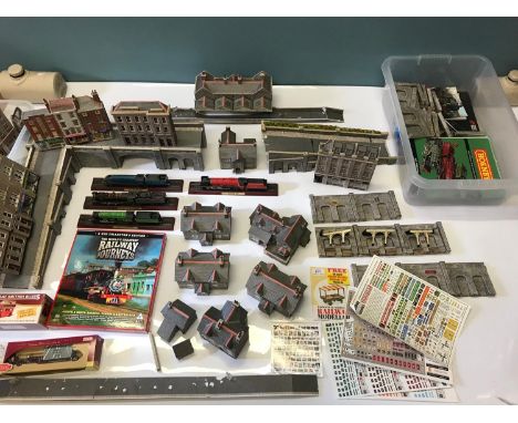 A Large collection of Model railway buildings, Bridges, Cottages and shop displays. Good quality items. 
