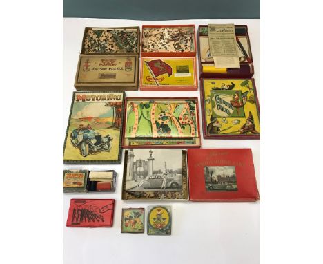 A Collection of old jig saws and games, Includes Conjuring Tricks, Cunard jig saw puzzle, Chad valley Motoring game & vintage