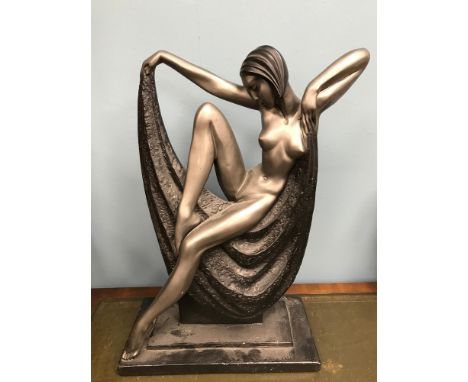 A large Art Deco style lady figurine.Very heavy figure.Signed to the back. Measures 59cm in height. 