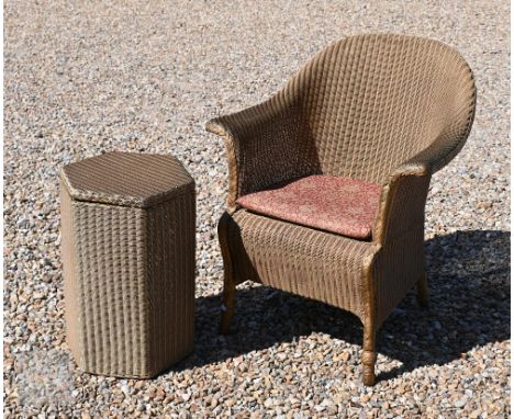 A Lloyd Loom wicker tub chair and laundry basket in gold painted finish (2) 