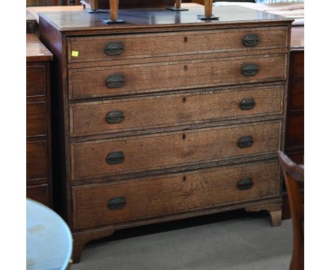A George III oak secretaire chest, the fall front top drawer enclosing fitted interior over three long graduated drawers a/f,