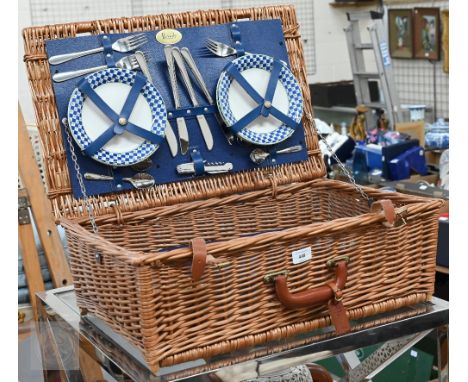 A Harrods wicker picnic hamper and contents (little used) 