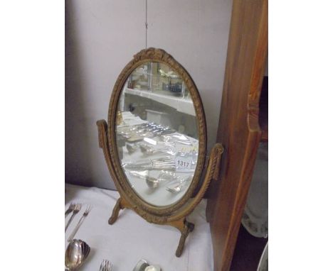 An oval framed swivel mirror, COLLECT ONLY.