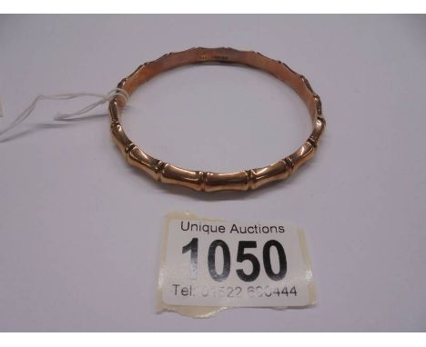 A 9ct gold bangle, 9.69 grams. (inside diameter approximately 8 cm).There is no splits, most lightly hollowCouple of small de