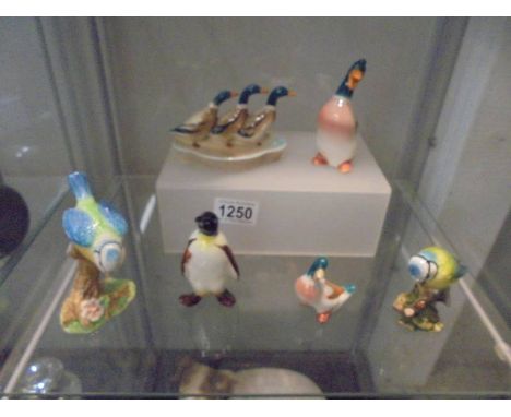 Six Beswick ducks and blue tits.