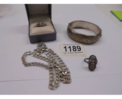 A silver bangle, silver chain and two silver rings, 47 grams.