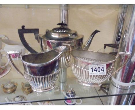 A three piece silver plate tea set.