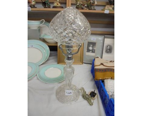 A heavy cut glass art deco table lamp.