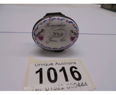 An 18th century Bilston enamel patch box inscribed "Remember Who Gave You This" with mirror in lid.&nbsp; Some age related cr