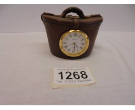 A novelty Aynsley clock in the shape of a Victorian hat box.