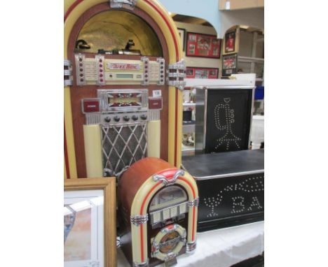 A large jukebox with radio, tape and cd, cd does not work, also a smaller jukebox radio and 2 boxed lights all in working ord