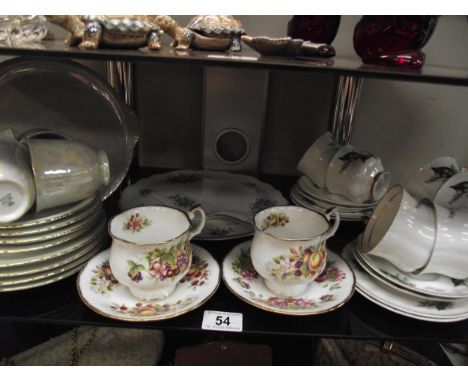An 18 piece teaset, 12 piece teaset large cake platter and 2 cups and saucers 