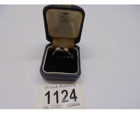 A 9ct gold ring set sapphire and white stones, size M, 1.69 grams