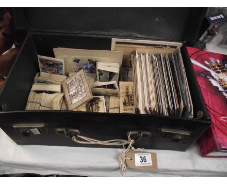An old case of postcards and photographic cigarette cards by Churchman, Senior Service, Beatall tobacco etc