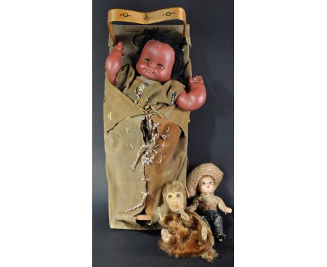 A collection of x2 vintage dolls and a believed Steiff puppet in the form of a monkey. The larger doll being a native America