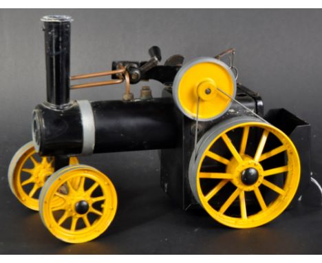An original vintage Mamod made live steam traction engine TWK1. Yellow and black colourway, with solid fuel tray present.&nbs