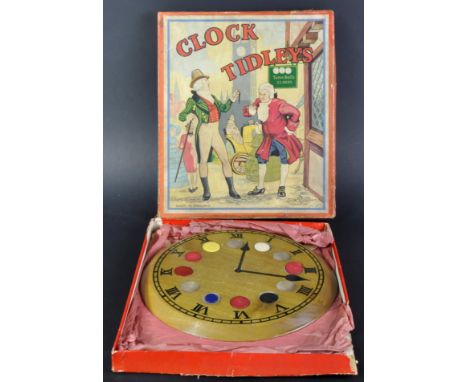 An original vintage Glevum Games made ' Clock Tidleys ' board game. The game containing a wooden board marked with clock face