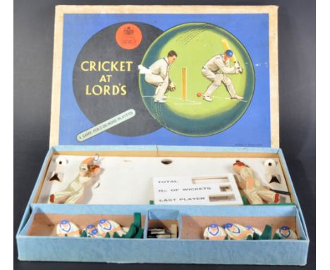 A vintage Chad Valley made ' Cricket At Lords ' table top cricket game. All wooden playing pieces with score board, bats, bal