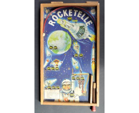 An original vintage bagatelle / billiards type ' Rocketelle ' Space game. Wooden rectangular board depicting a Space scene, p