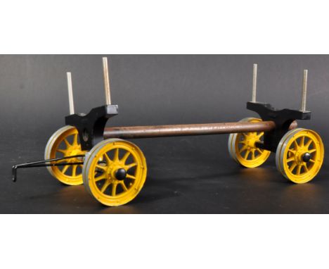 An original Mamod made log carrier trailer. Yellow and black colourway for use on the&nbsp;TWK1 traction engine.