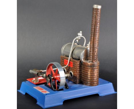 An original vintage German Wilesco made stationary steam engine plant with tin housed brickwork effect horizontal boiler and 