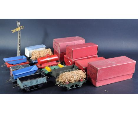 A collection of assorted vintage Hornby made tinplate O gauge model railway trainset locomotive rolling stock. Various wagons