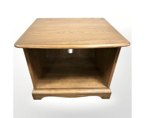 An Ercol elm entertainment/lamp table, width 64 cm 