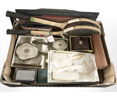 Two dressing table brush and mirror sets, a gents travel set, two vintage tennis rackets, set of playing cards in metal case,