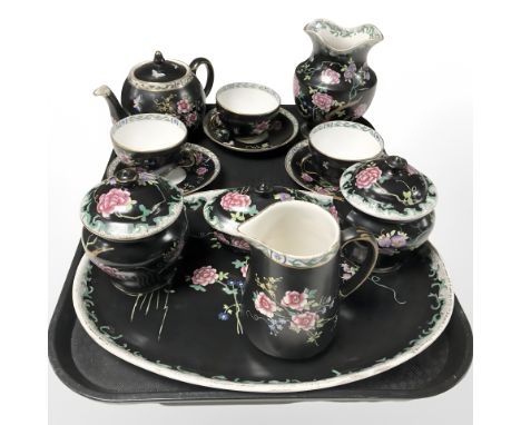 A group of Maling dressing table china and tea china on black ground.