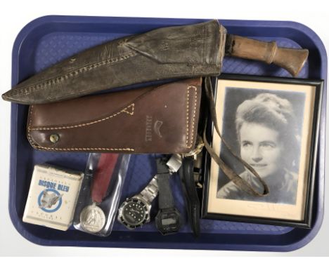 A kukri knife in sheath, leather pistol holster, reproduction Waterloo medal, quartz wristwatches, signed photograph, etc. 