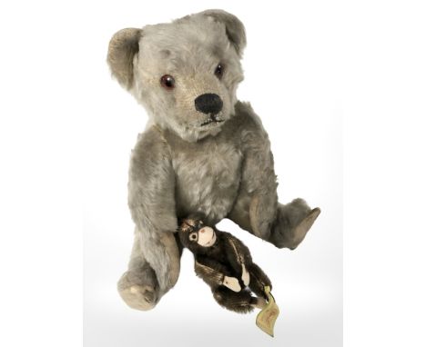 A vintage jointed mohair teddy bear, height 27 cm, and a small Steiff monkey.