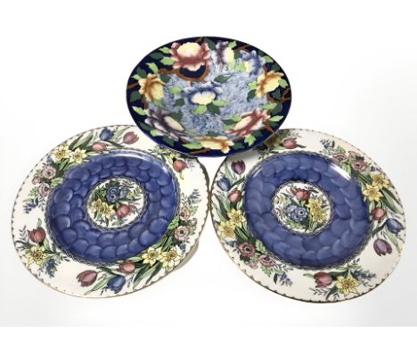 A pair of Maling lustre daffodil plates and a further fruit bowl.