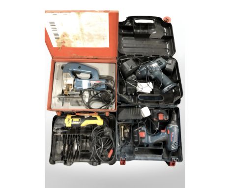 A group of boxed power tools including Bosch jigsaw, Stanley angle grinder, Black & Decker drill, etc.