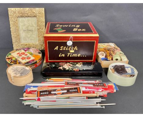 A painted sewing box, threads, button and other accoutrements, Victorian papier-mâché box etc