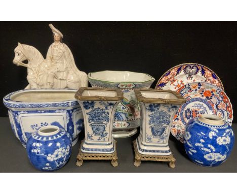 A pair of Chinese brass mounted tapering vases, decorated in tones of underglaze blue with baskets of flowers, 19.5cm high ov