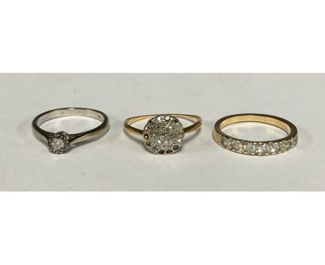 A diamond solitaire ring, illusion set, 9ct  white gold shank, size M,  2.0g;  diamond cluster ring, unmarked yellow metal sh