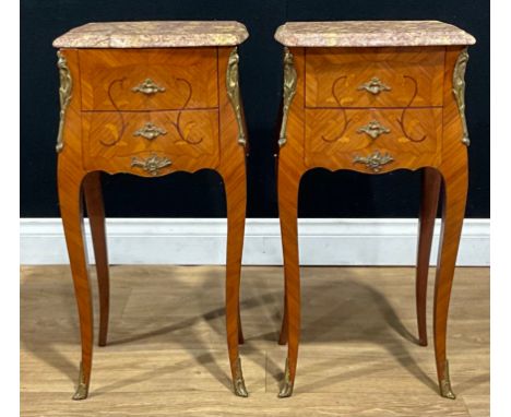 A pair of Louis XV style kingwood, mahogany and marquetry lamp tables, each with a marble top above a pair of drawers, French