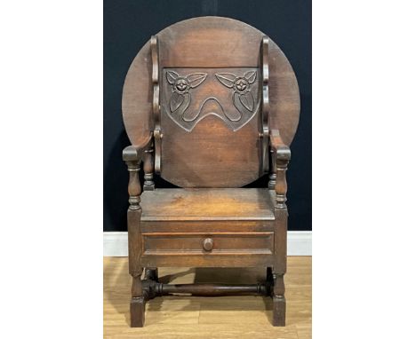 An Art Nouveau period oak monk’s bench or chair, opening to 116cm high, 77cm wide, the seat 40cm deep, c.1910