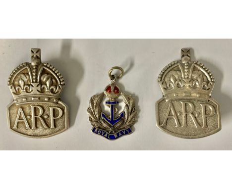 Two hallmarked silver ARP badges; a silver and enamel Royal Navy fob, 22g gross