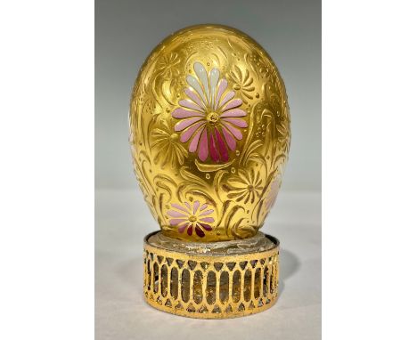 A gilt porcelain egg, decorated with raised gilt and pink enamel flowers, possibly by Stefan Nowacki, 5cm high