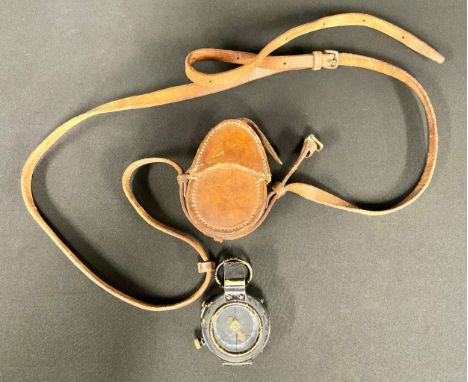 A military marching compass, mark IX, leather case