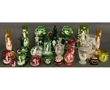 A 19th century Mary Gregory style emerald glass decanter, applied in white enamel with a boy in a garden setting, picked out 