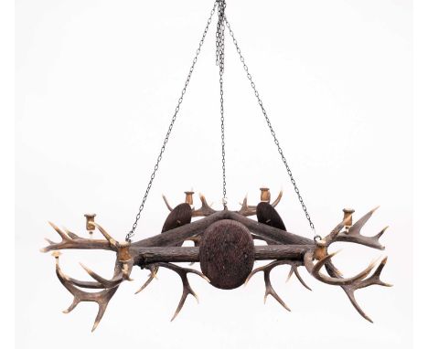 Antler Furniture: A Late 19th Century Austro-German Carved Wood &amp; Antler Mounted Chandelier, circa 1900, of triangular fo