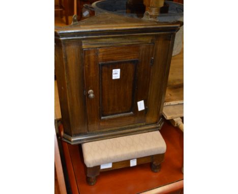 A small oak hanging corner cupboard, a stool, a stationery tray and a magazine rack.