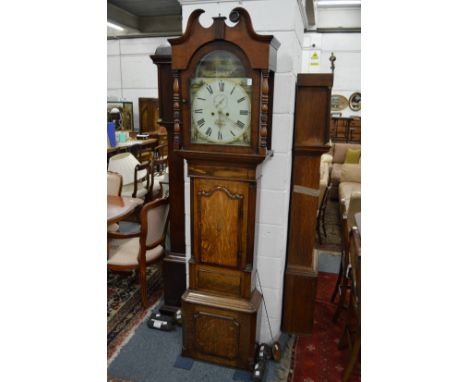 An 18th century oak and mahogany longcase clock with eight day movement, the painted arch dial signed Smith, Walton.