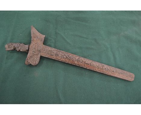 A Malaysian Kris with well carved handle and scabbard.