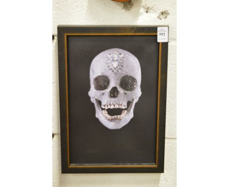 In the manner of Damien Hirst, The Crystal Skull, a photographic print on canvas, framed.