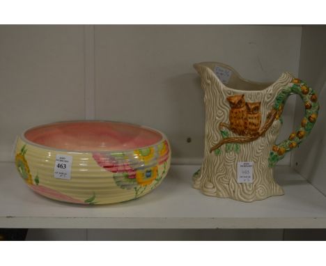 Clarice Cliff, a floral decorated circular bulb bowl, together with a Clarice Cliff jug moulded as a tree with owls seated on